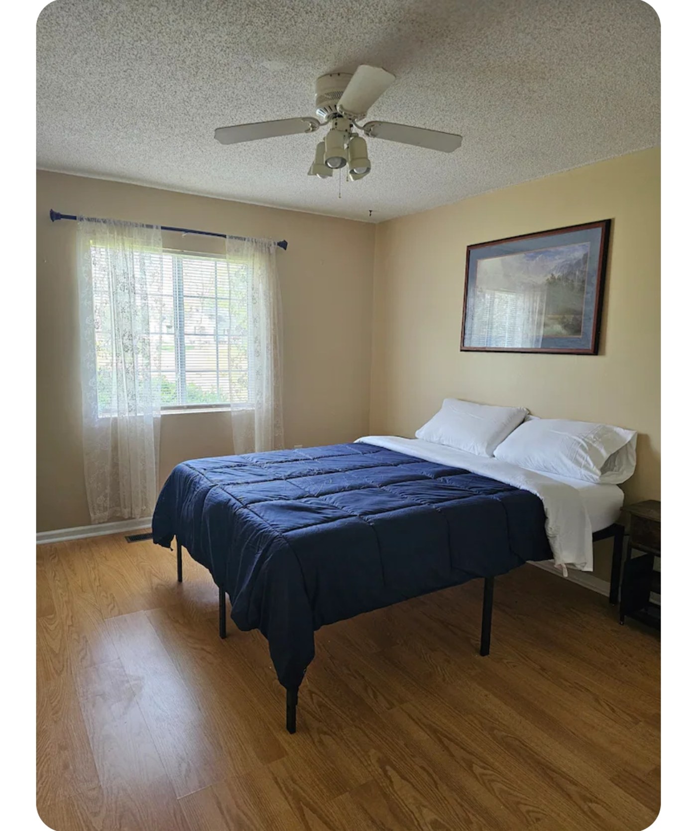 Bright farmhouse bedroom with queen bed