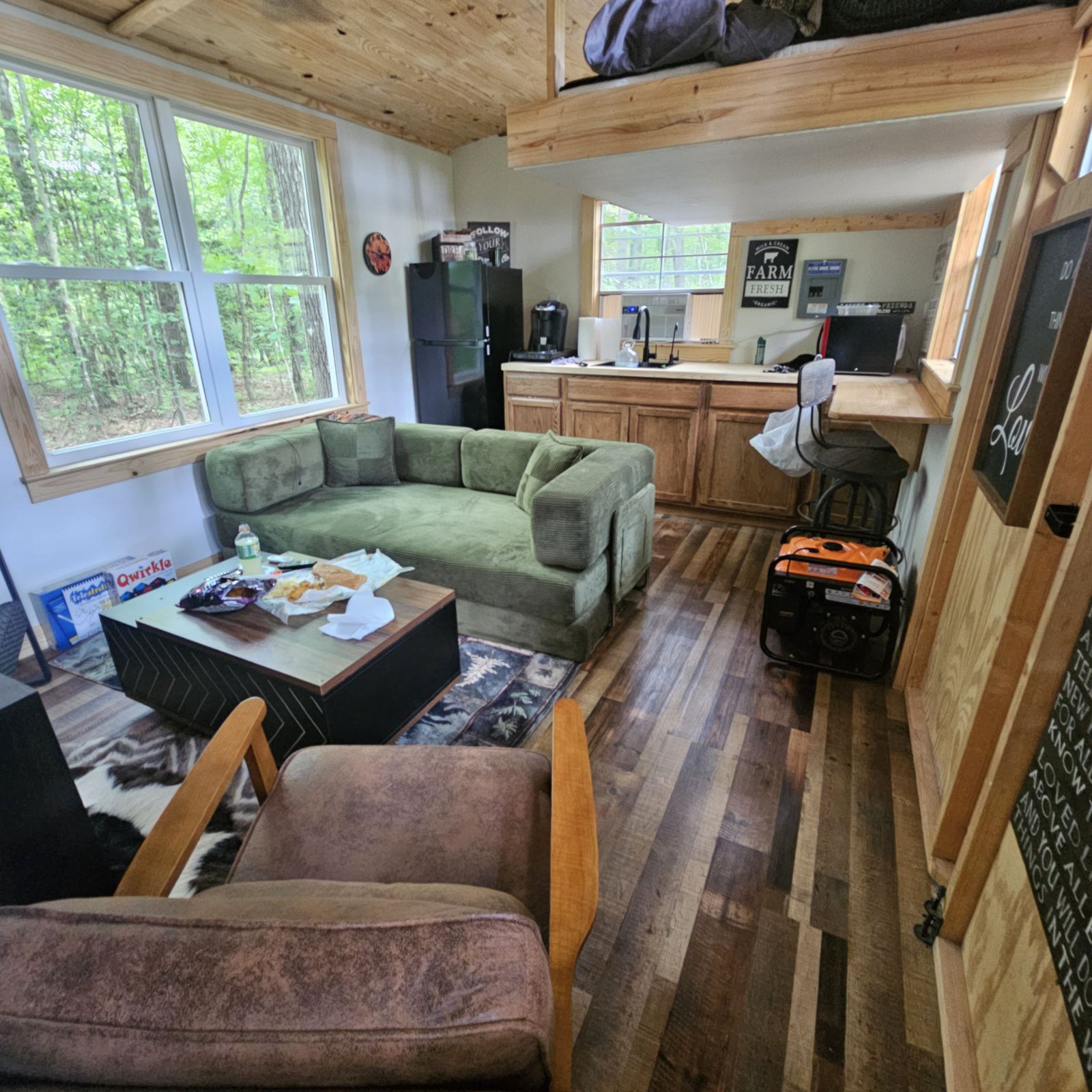 Inside the cabin, with kitchenette and loft