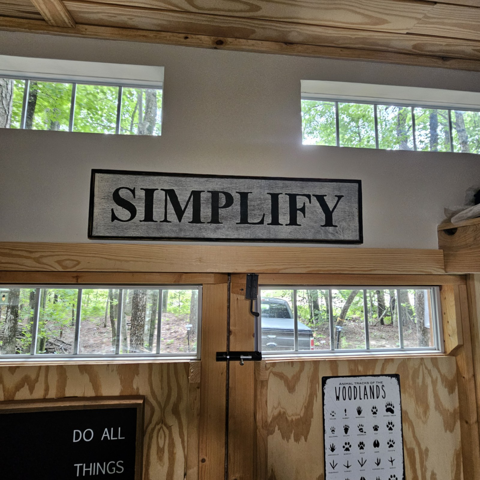 Vaulted ceiling with clerestory windows and Simplify sign